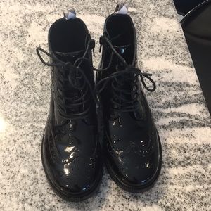 All black pat and leather Burberry flat boots.